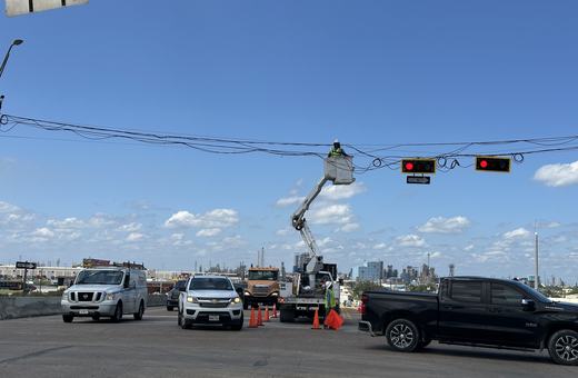 Span-wire signal work under traffic control