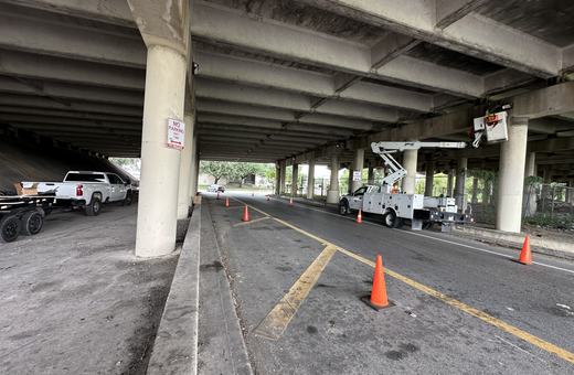 Lighting work under an overpass