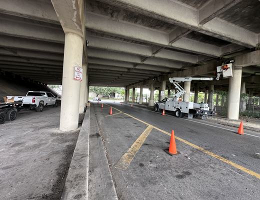 Lighting work under an overpass