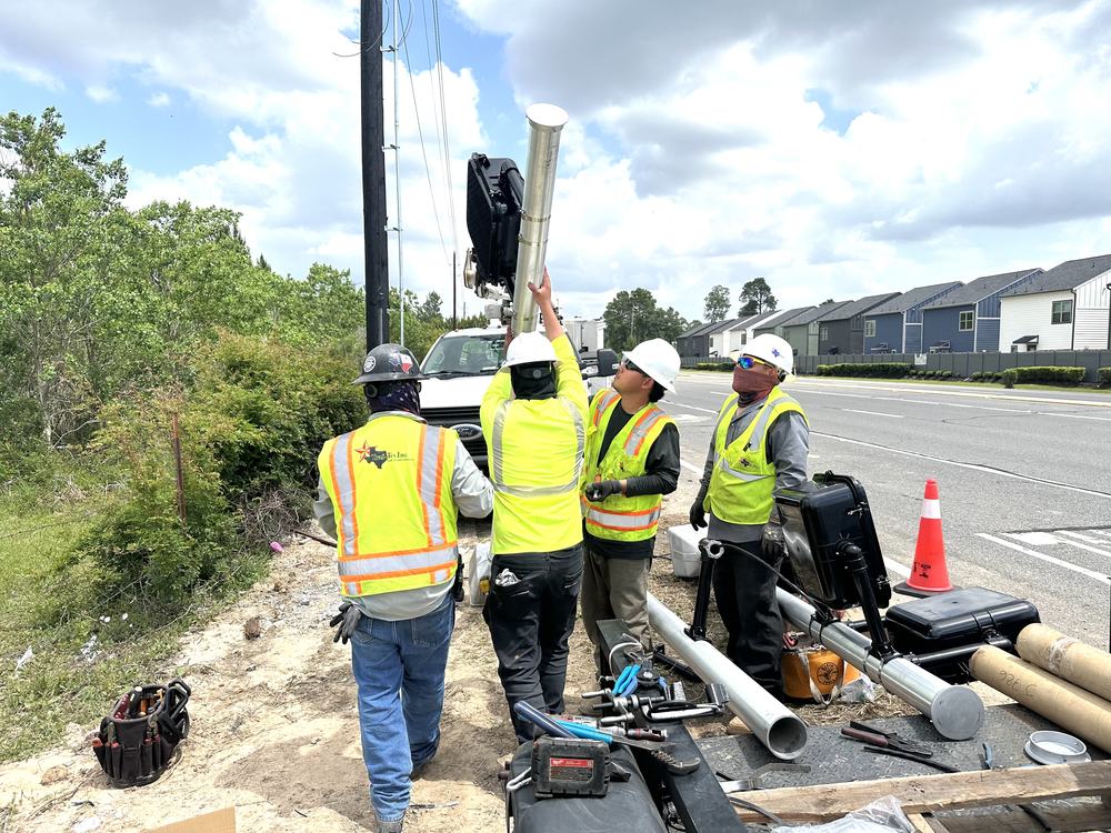Traf-Tex crew setting a signal pole